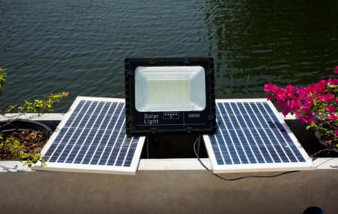 Solar panels powering spotlight in the garden